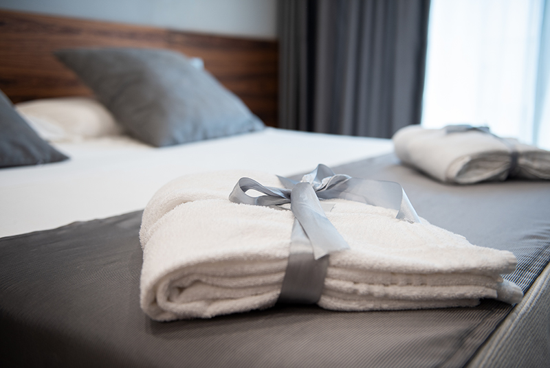 Bathrobe on bed in hotel room